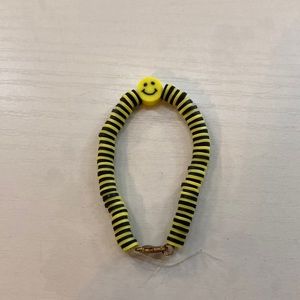 Smiley face black and yellow clay bead bracelet